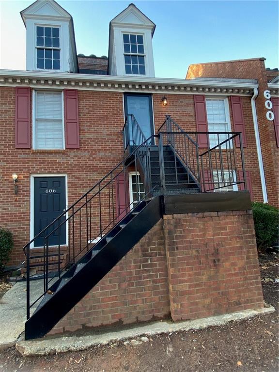 1166 Booth Road Southwest, Unit 610 Marietta, GA 30008 - Photo 18 of 20 a view of a house with wooden deck