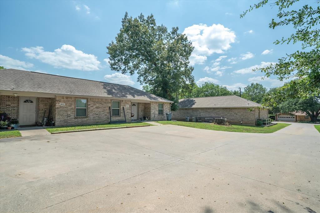 202 Chestnut Drive Van, TX 75790 - Photo 1 of 12 View of front of home featuring brick siding, a front yard, and a shingled roof