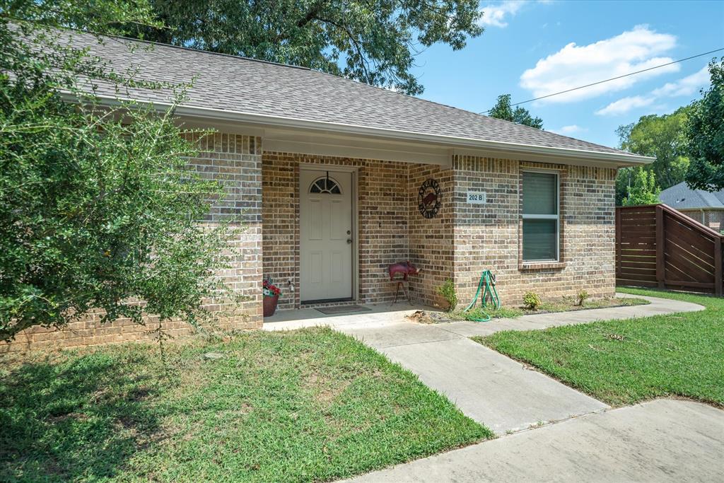 202 Chestnut Drive Van, TX 75790 - Photo 7 of 12 View of front of home with brick siding and a shingled roof