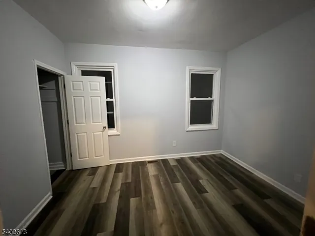 a view of wooden floor in an empty room
