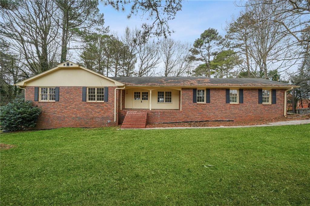 665 Arnold Road Lawrenceville, GA 30044 - Photo 11 of 38 a front view of a house with yard