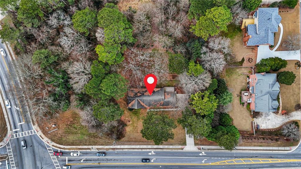 665 Arnold Road Lawrenceville, GA 30044 - Photo 2 of 38 an aerial view of house with yard