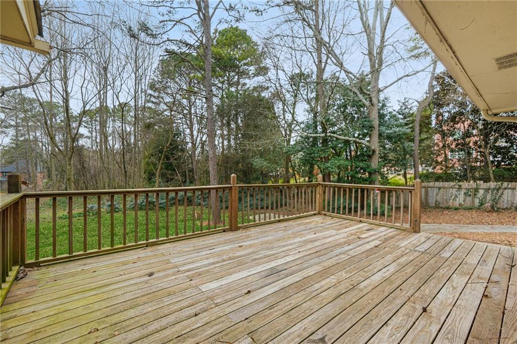 665 Arnold Road Lawrenceville, GA 30044 - Photo 27 of 38 a view of balcony with wooden floor and fence