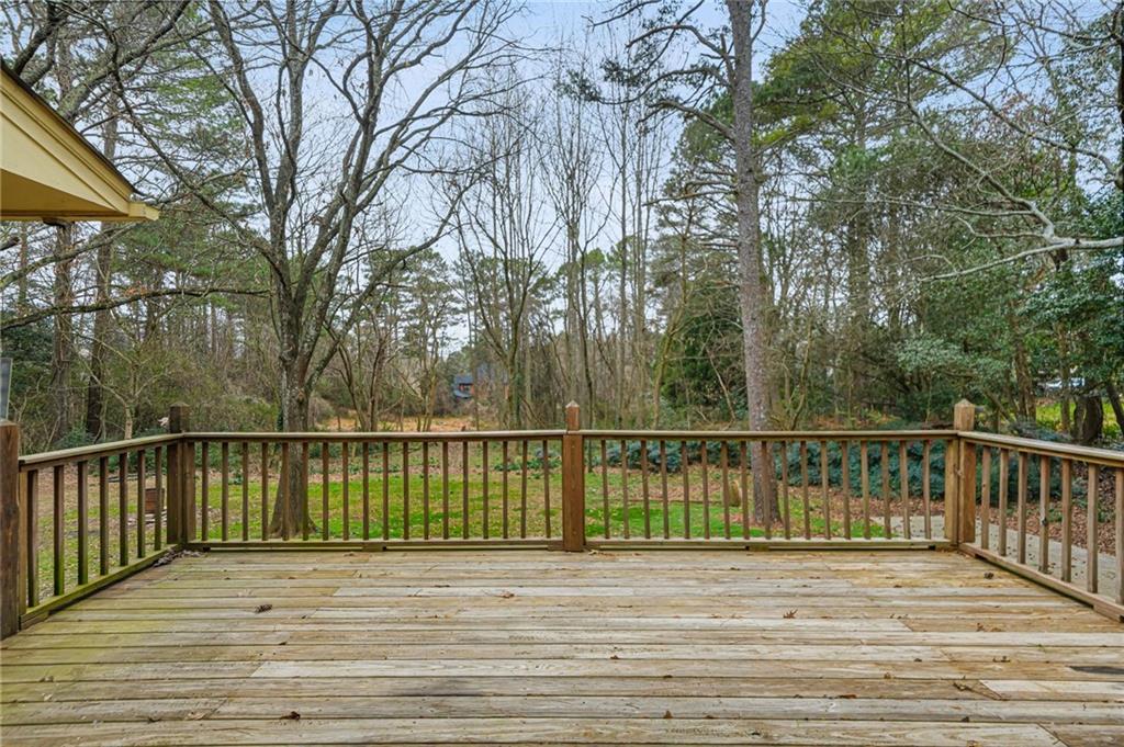 665 Arnold Road Lawrenceville, GA 30044 - Photo 29 of 38 a view of a balcony with wooden floor and fence