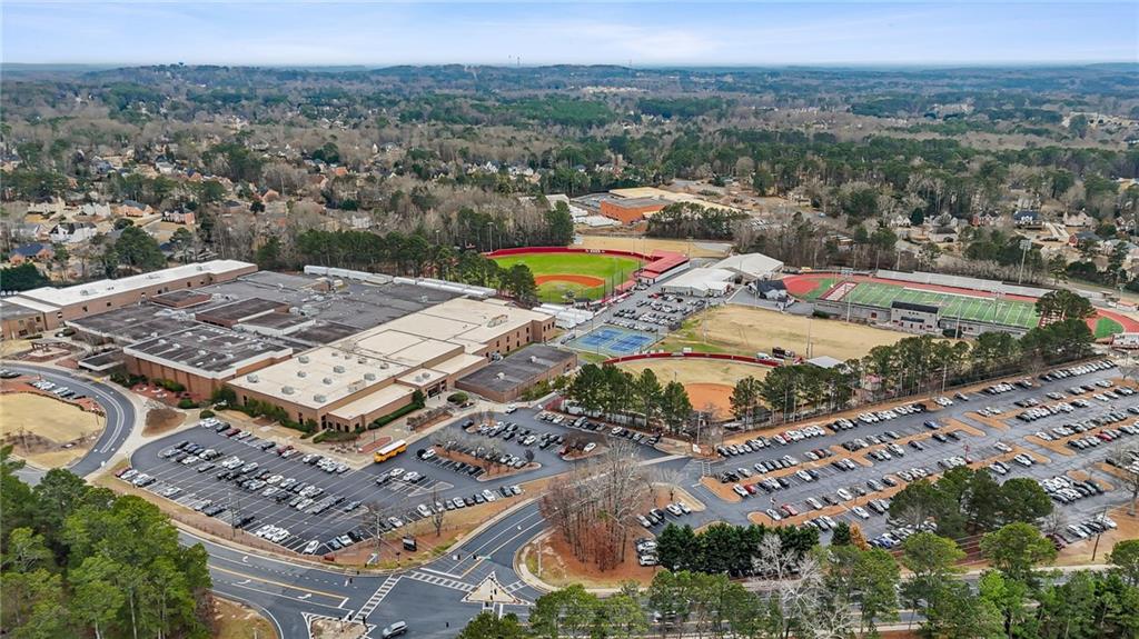 665 Arnold Road Lawrenceville, GA 30044 - Photo 38 of 38 an aerial view of a house with a lake view