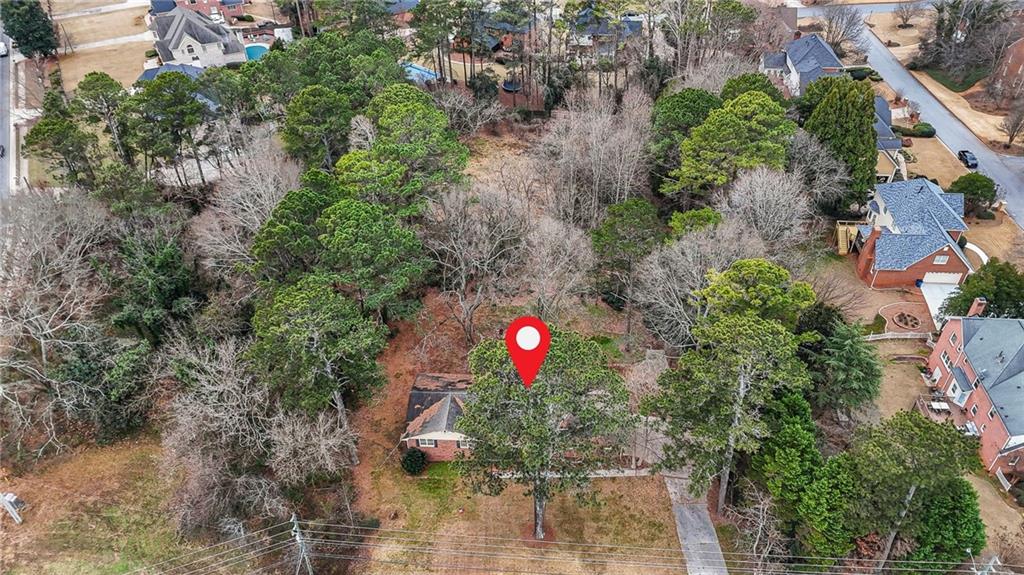 665 Arnold Road Lawrenceville, GA 30044 - Photo 4 of 38 an aerial view of a house with a yard and outdoor seating