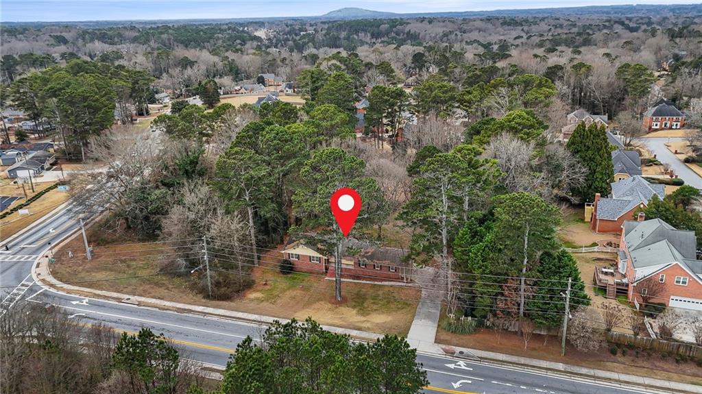 665 Arnold Road Lawrenceville, GA 30044 - Photo 10 of 38 an aerial view of a house with swimming pool and mountains