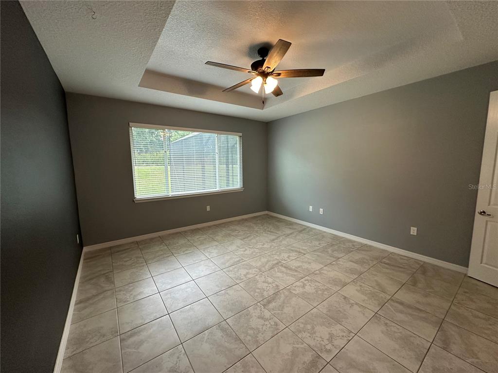 7526 Southwest 65th Place Road Ocala, FL 34474 - Photo 13 of 28 a view of an empty room with a window
