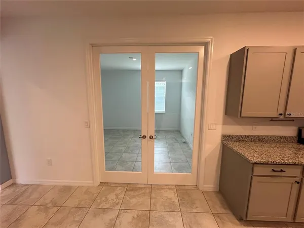 a view of an empty room with a window