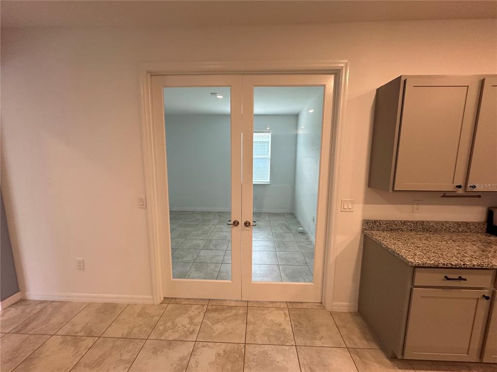 7526 Southwest 65th Place Road Ocala, FL 34474 - Photo 17 of 28 an empty room with mirror