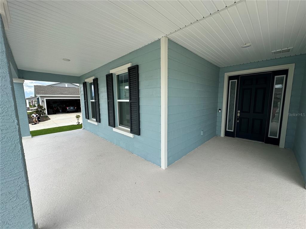 7526 Southwest 65th Place Road Ocala, FL 34474 - Photo 2 of 28 an empty room with fireplace and windows