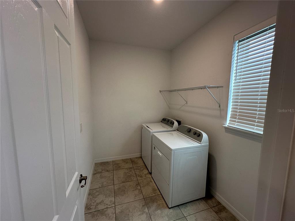 7526 Southwest 65th Place Road Ocala, FL 34474 - Photo 28 of 28 a utility room with dryer and washer