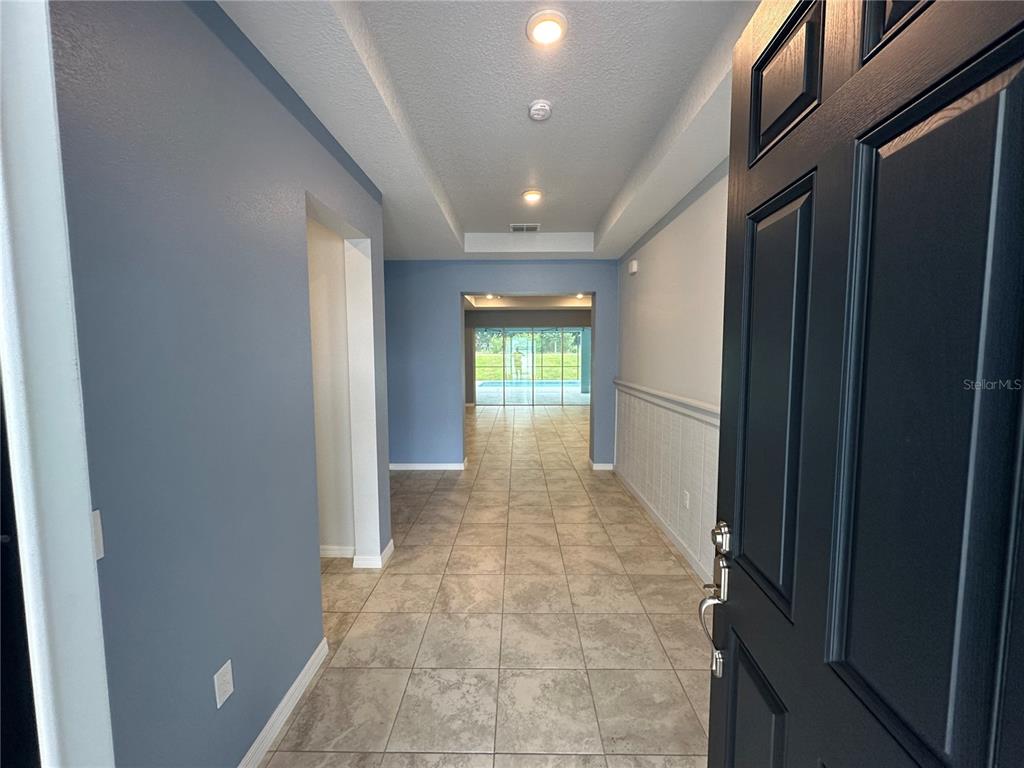 7526 Southwest 65th Place Road Ocala, FL 34474 - Photo 5 of 28 a view of entryway with a hallway