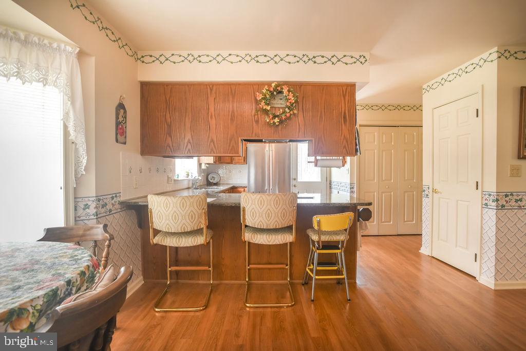 2 Battle Drive Newark, DE 19702 - Photo 13 of 35 a dining room with furniture and wooden floor