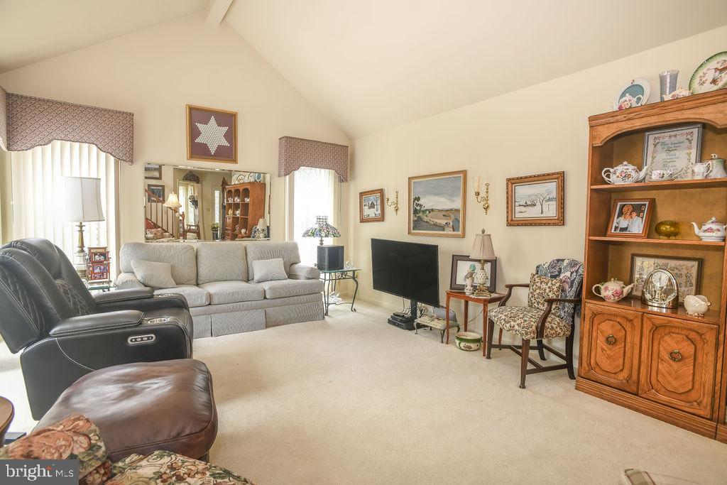 2 Battle Drive Newark, DE 19702 - Photo 14 of 35 a living room with furniture and a flat screen tv