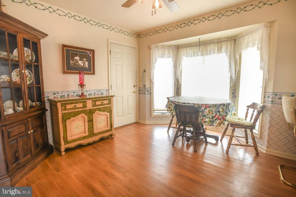 2 Battle Drive Newark, DE 19702 - Photo 20 of 35 a view of a dining room with furniture window and wooden floor
