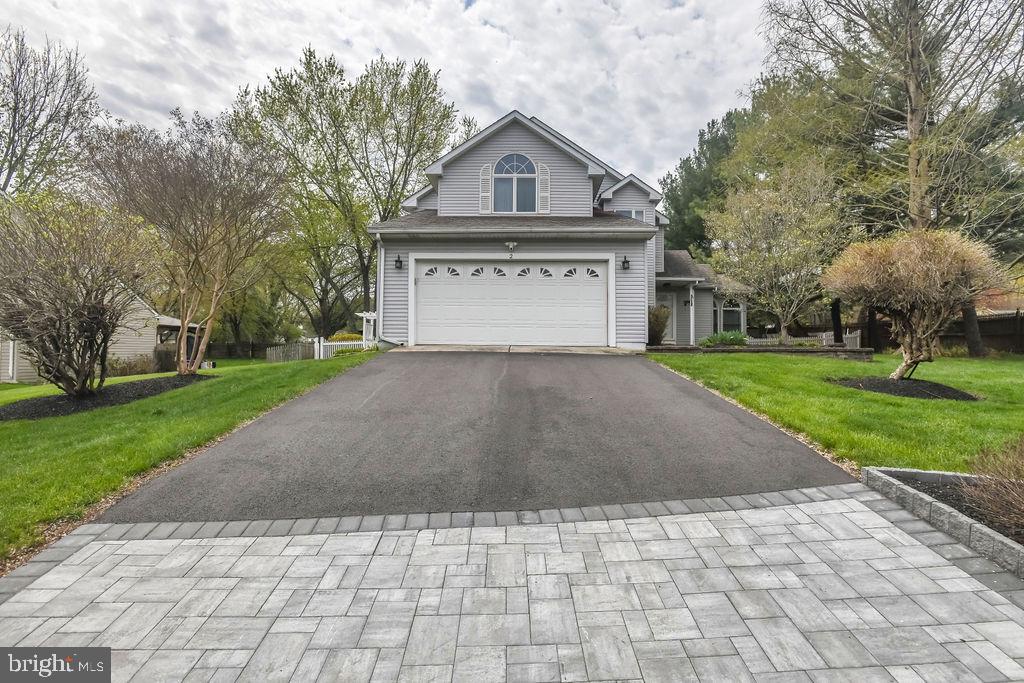 2 Battle Drive Newark, DE 19702 - Photo 2 of 35 a front view of a house with a yard and garage
