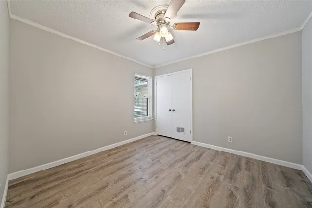 a view of hallway with wooden floor