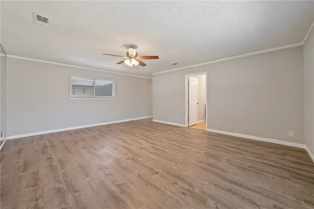 a bathroom with a granite countertop sink a mirror and a vanity