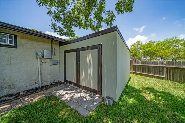 a view of an empty room with windows