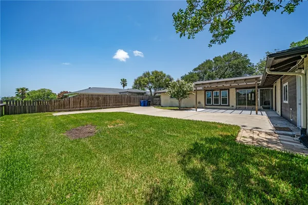 front view of a house with a garden