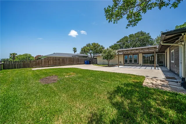 front view of a house with a garden