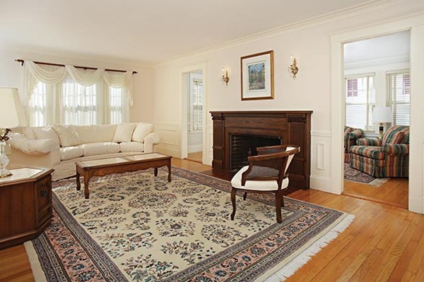 42 Lovell Road Watertown, MA 02472 - Photo 2 of 6 a living room with furniture and a fireplace