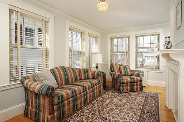 42 Lovell Road Watertown, MA 02472 - Photo 5 of 6 a living room with furniture and a floor to ceiling window