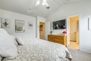 3932 Asbury Lane Addison, TX 75001 - Photo 11 of 18 a bedroom with a bed and a flat screen tv