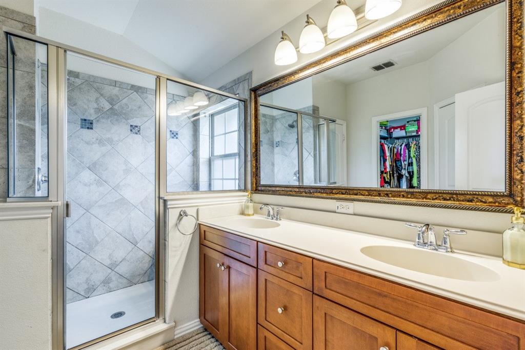 3932 Asbury Lane Addison, TX 75001 - Photo 12 of 18 a bathroom with a sink and a mirror
