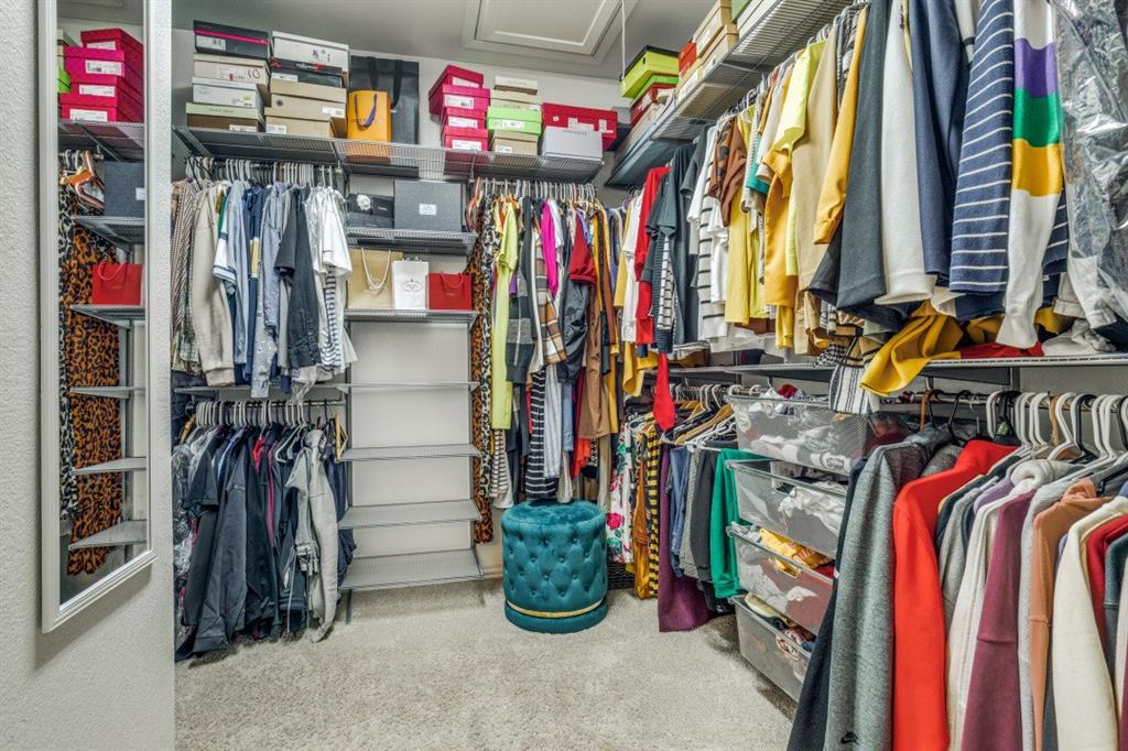 3932 Asbury Lane Addison, TX 75001 - Photo 13 of 18 a view of walk in closet with clothes