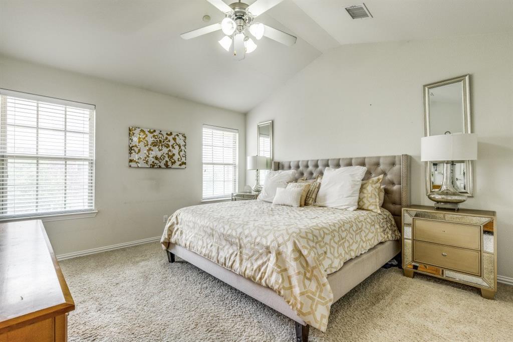 3932 Asbury Lane Addison, TX 75001 - Photo 10 of 18 a bedroom with a bed and window