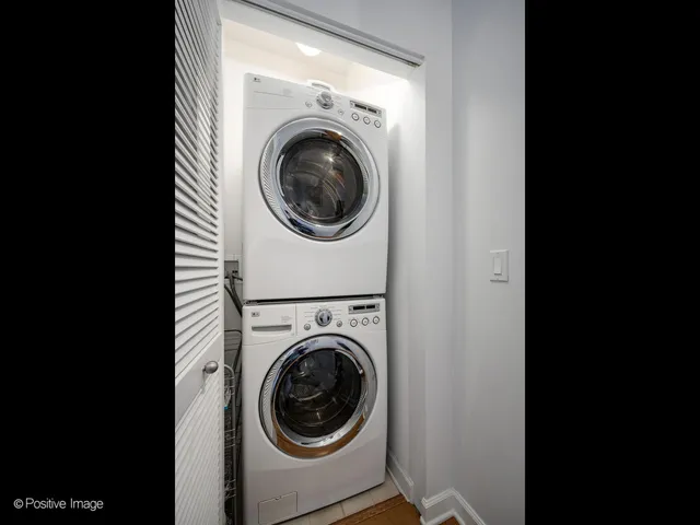 a view of a hallway with washer and dryer