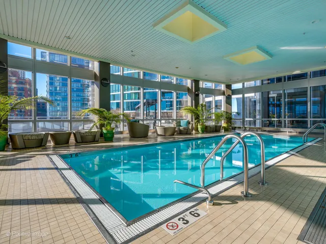 a view of swimming pool with outdoor seating