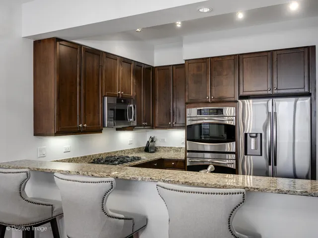 a kitchen with a sink a stove and refrigerator