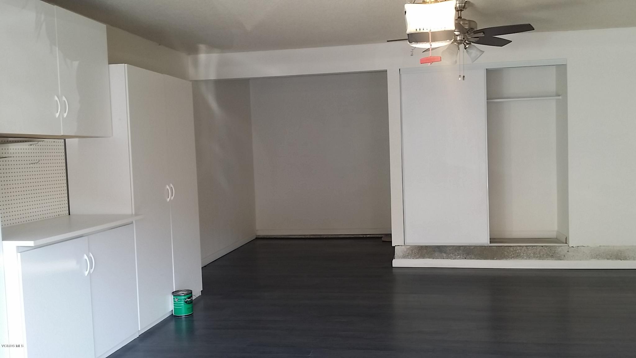 15076 Varsity Street, Unit C Moorpark, CA 93021 - Photo 15 of 18 an empty room with wooden floor and windows