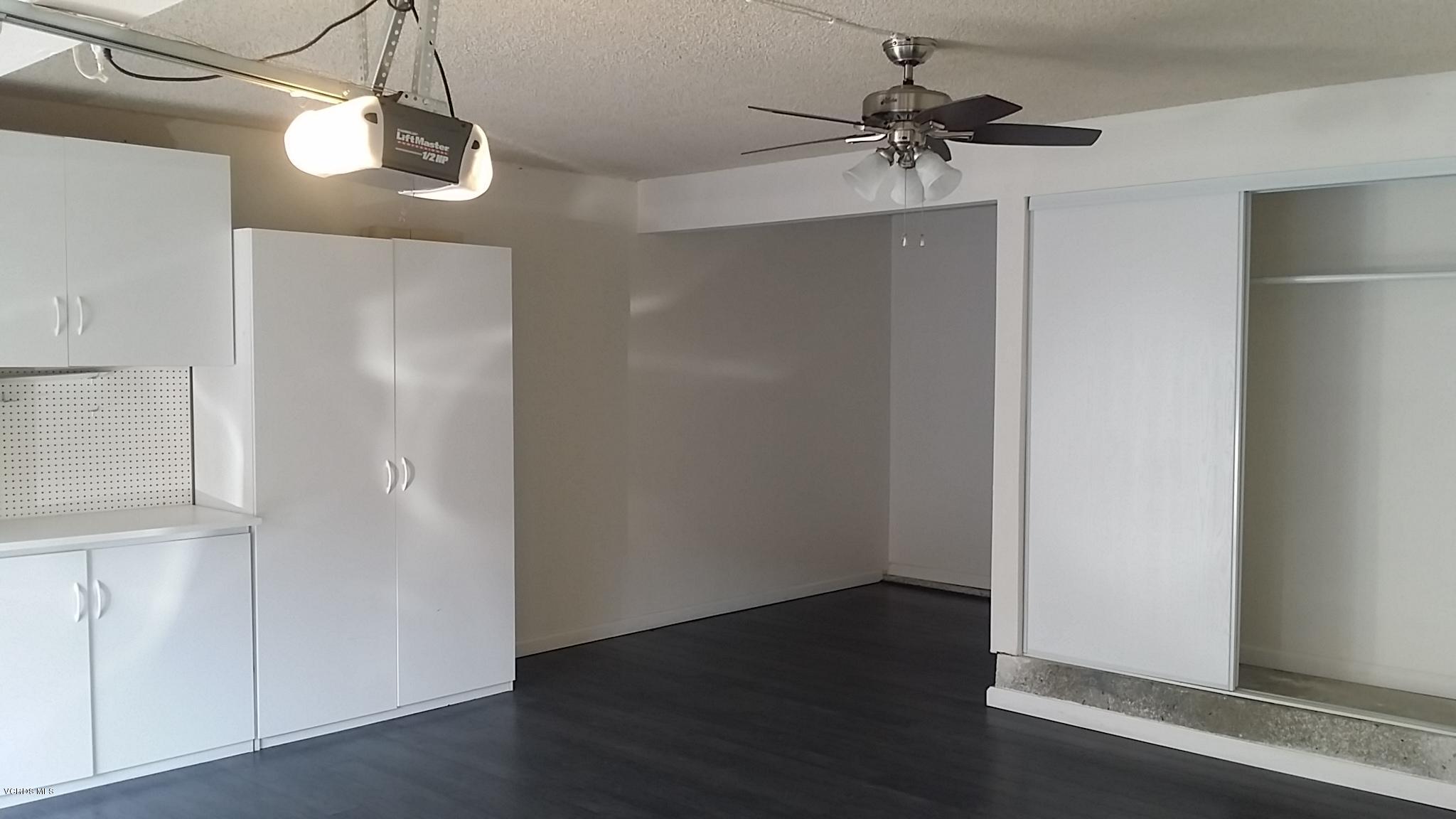 15076 Varsity Street, Unit C Moorpark, CA 93021 - Photo 16 of 18 a view of a chandelier fan and wooden floor