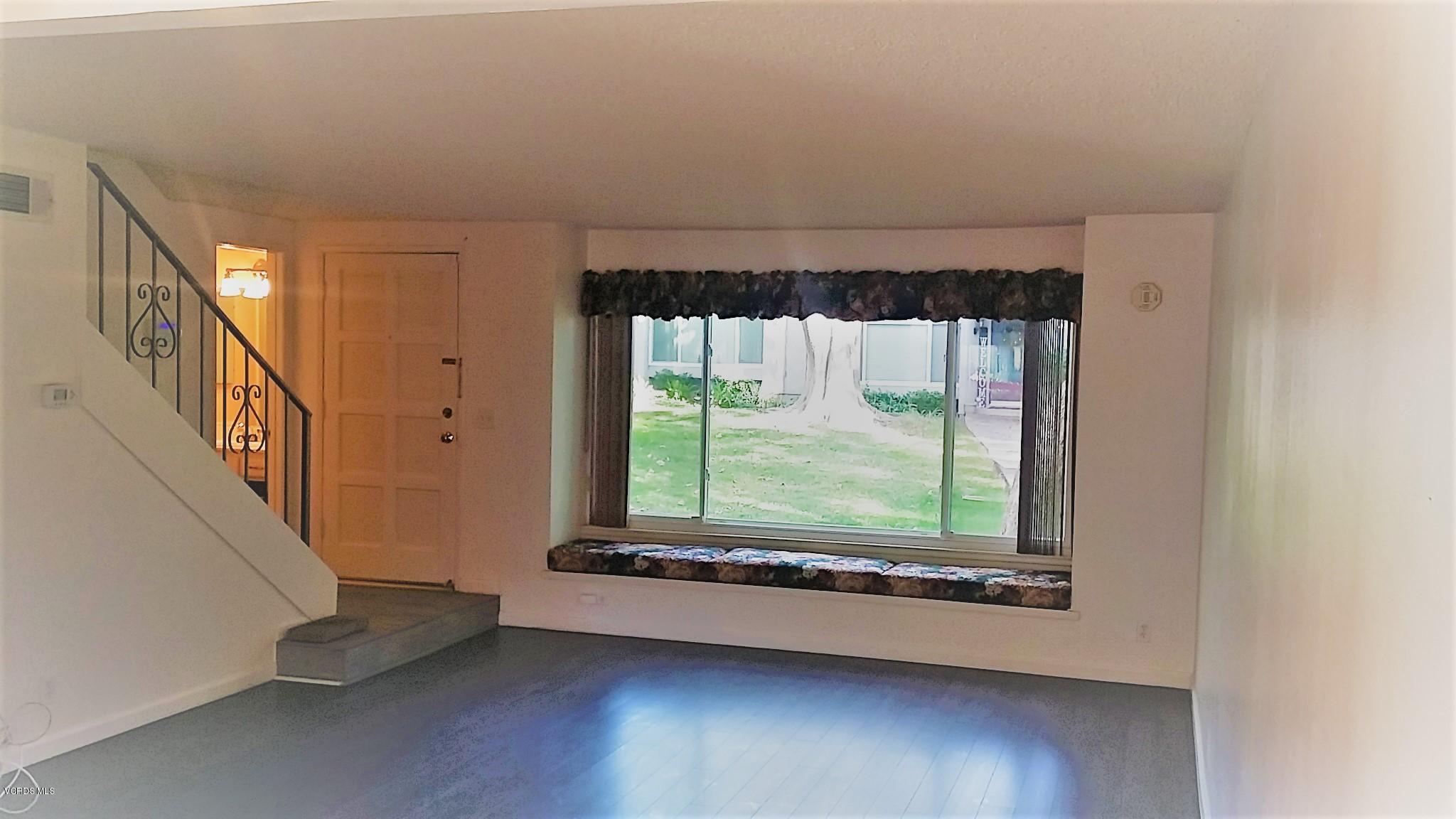 15076 Varsity Street, Unit C Moorpark, CA 93021 - Photo 3 of 18 a view of a room with wooden floor and windows