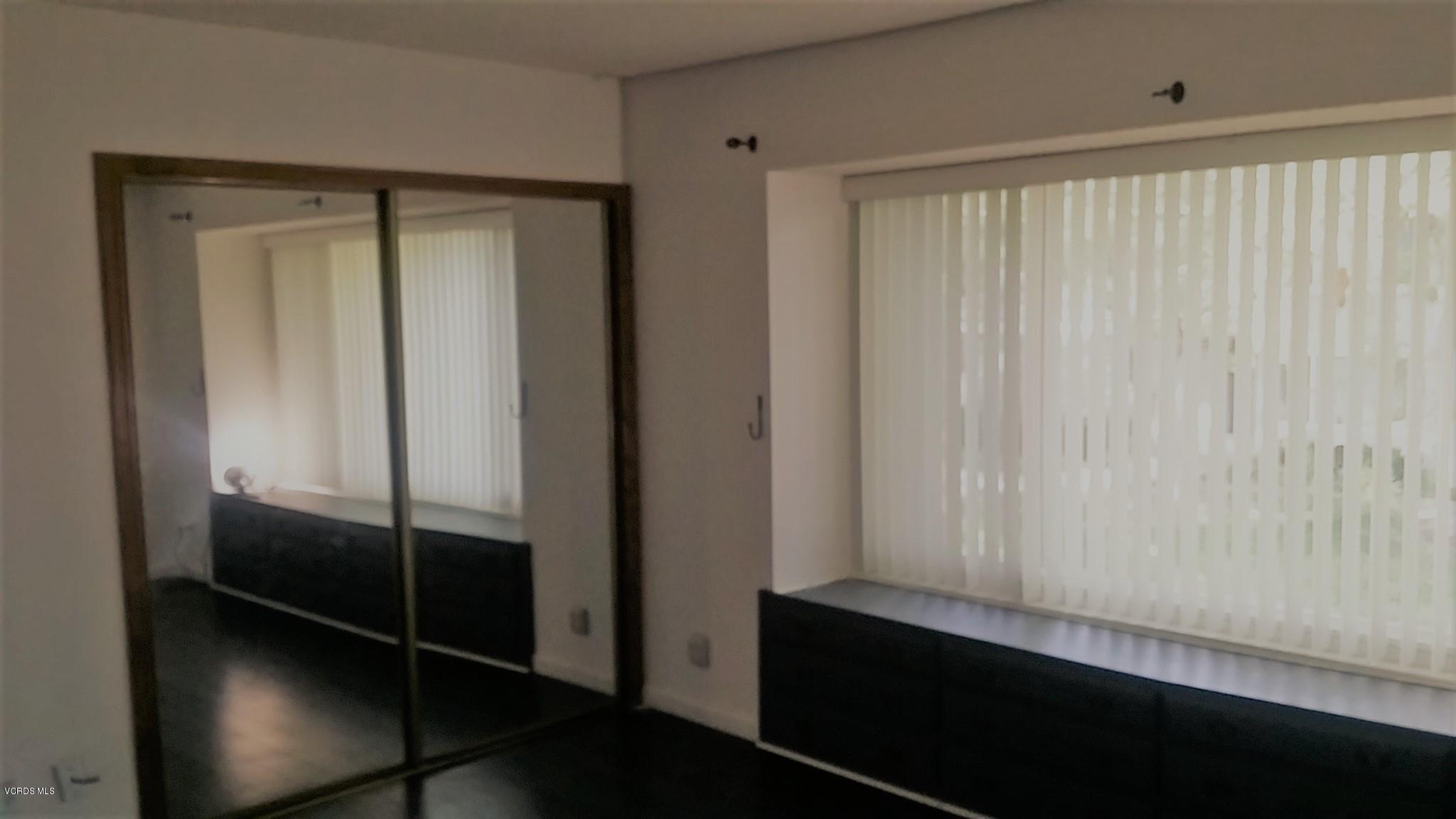 15076 Varsity Street, Unit C Moorpark, CA 93021 - Photo 5 of 18 a view of elevator with wooden floor