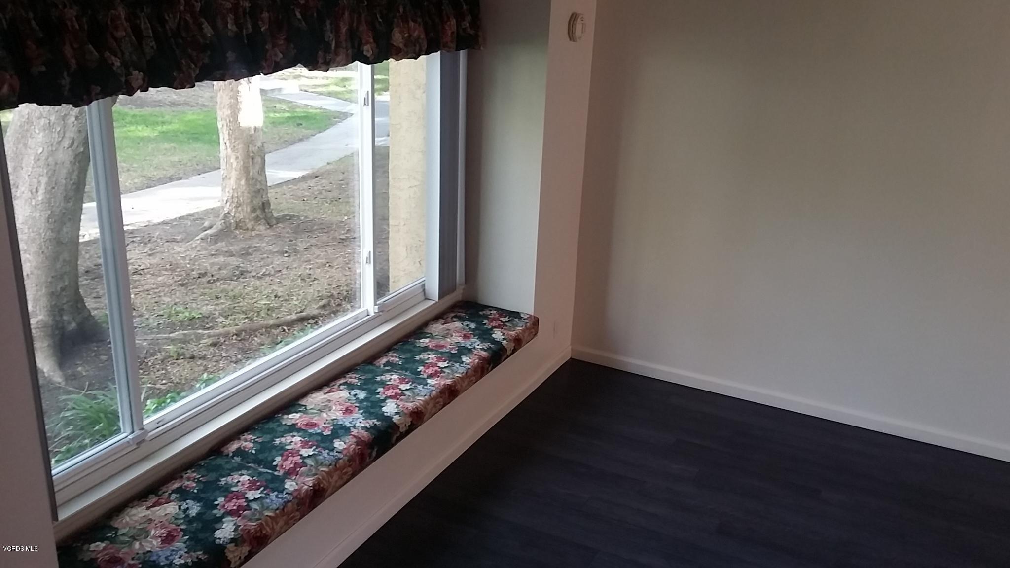 15076 Varsity Street, Unit C Moorpark, CA 93021 - Photo 6 of 18 a view of a room with wooden floor and walls