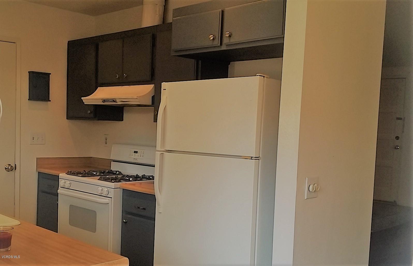 15076 Varsity Street, Unit C Moorpark, CA 93021 - Photo 10 of 18 a kitchen with a refrigerator and a stove