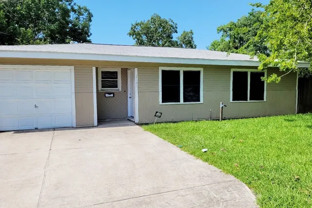 a view of a house with a garden