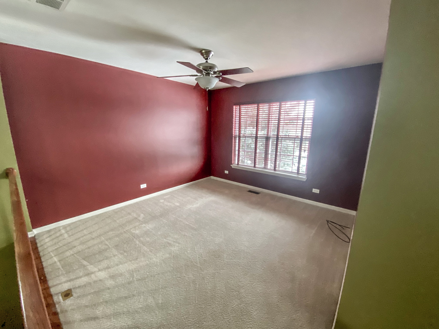 2249 Hudson Circle Aurora, IL 60502 - Photo 6 of 30 an empty room with windows and fan