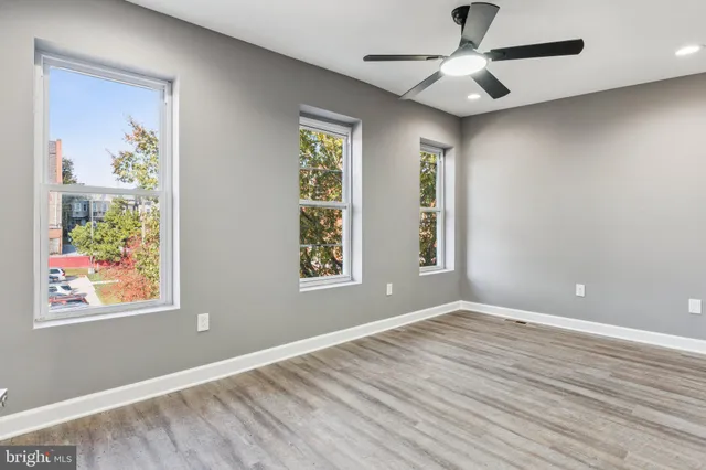 a view of room with window and ceiling fan