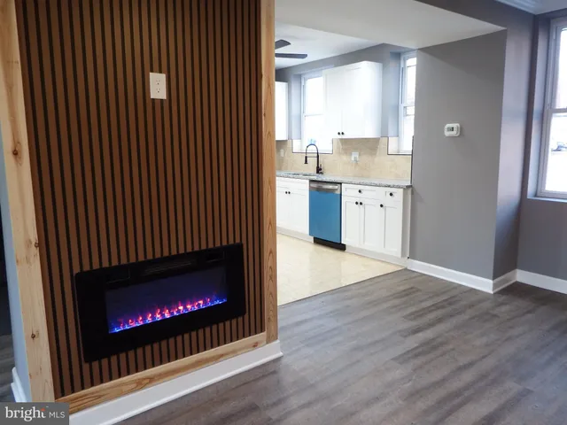 a view of open kitchen with a fireplace
