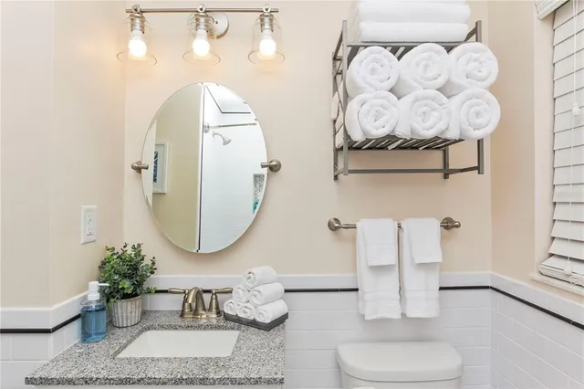 a bedroom with a bed and a mirror