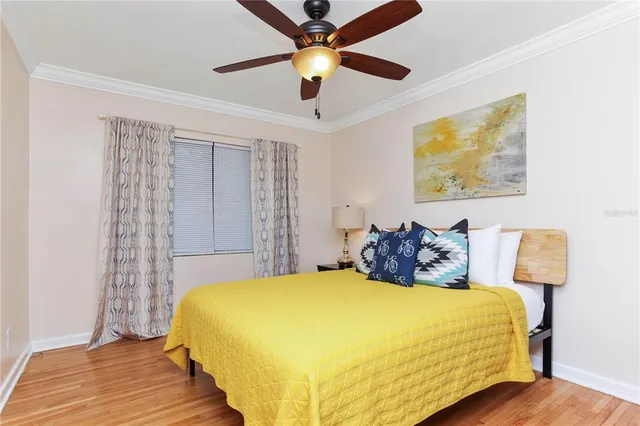 a bedroom with a bed and a mirror