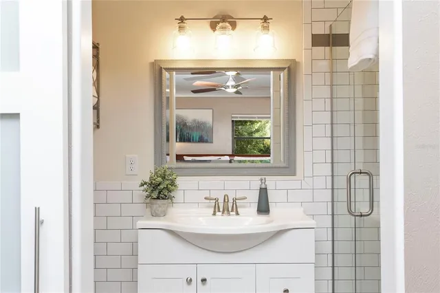 a bathroom with a sink and a mirror