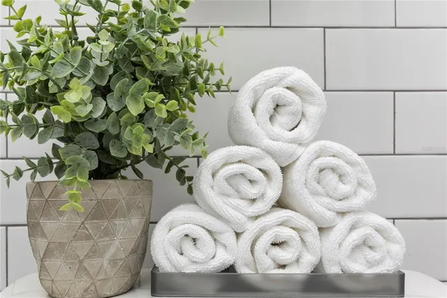 a bathroom with a sink a mirror and shower