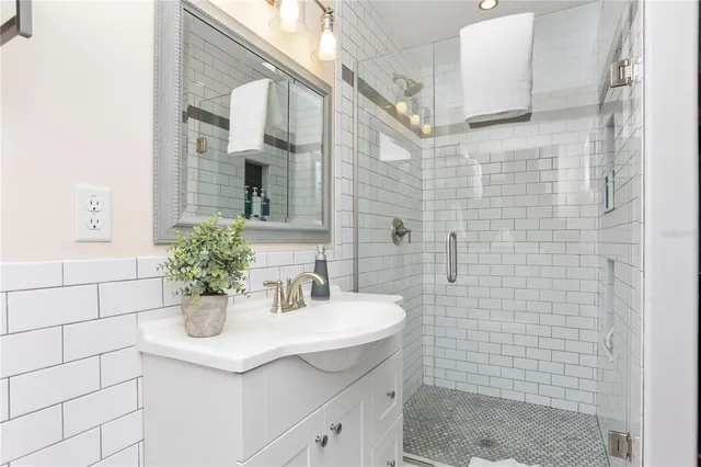 a blue couch sitting next to a lamp